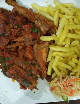 Pan fried chicken and chips + a soda