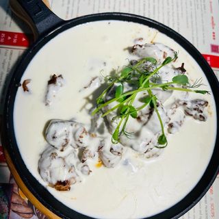 Chicken fillet with creamy garlic sauce "Shkmeruli"