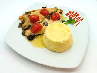 Branzino con salsa di pinoli