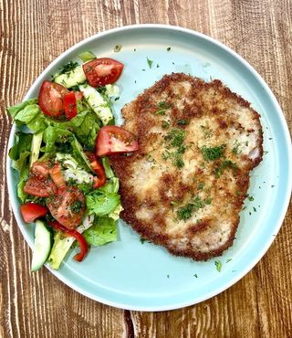 Pork schnitzel with mixed salad
