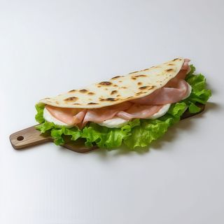 Piadina con mortadella Bologna, squacquerone, crema carciofi, rucola