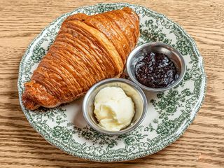 Сroissant with butter and jam