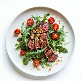 Tagliata di entrecote con rucola, pomodorini e scaglie