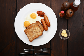 Two eggs with sausage