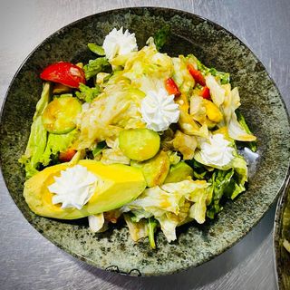 Avocado salad with lettuce leaves and cherry tomatoes