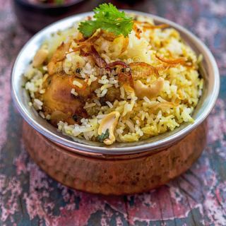 Chicken Hyderabadi Biryani - Medium Pack (650 ML) + 1 Drink