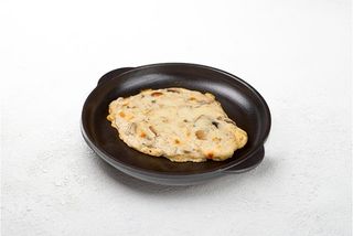 Куряча грудка запечена під грибним соусом