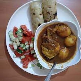 Chicken stew with 2 chapatis and a side