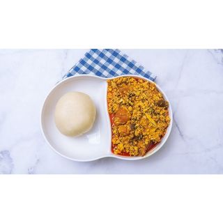 Egusi soup and Semo with meat and Kpomo