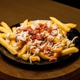 Ración De Patatas Trufadas