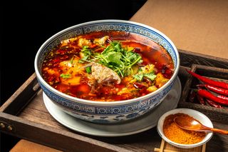 88. Branzino in brodo rosso