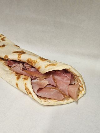 Rotolo porchetta alla brace, funghi e fontina