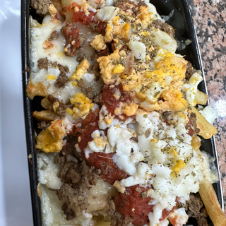 Patatas A La Boloñesa