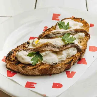 Bruschetta con stracciatella e alici del cantabrico