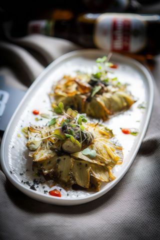 Alcachofas confitadas con jamón ibérico