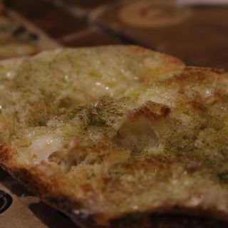 Queso curado, aceite y orégano (media porción)