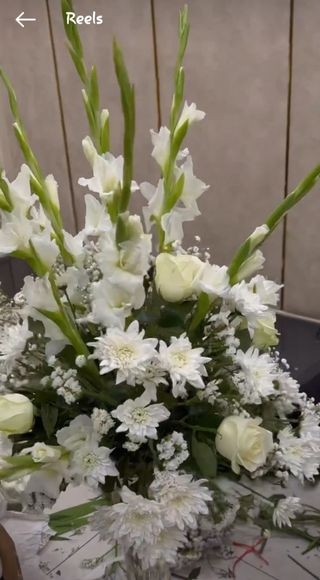 Pure Elegance :A blend of while gladiolus ,mums, fillers and roses .