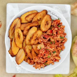FRIED PLANTAIN, EGG SAUCE. COLD DRINK