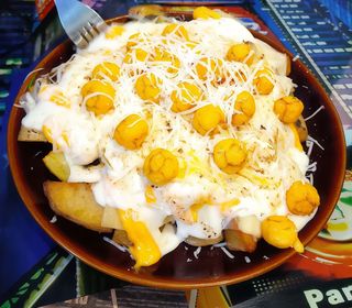 Patatas 4 quesos gratinadas (1/2 ración)