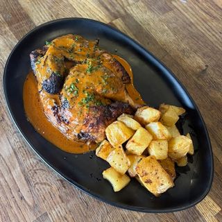 Medio pollo "de la terra" a la brasa al curry