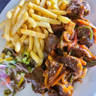 Pan Fried Goat served with Chips
