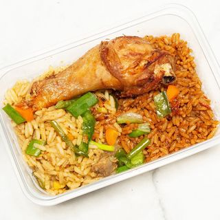 Half fried rice and half jollof rice with chicken