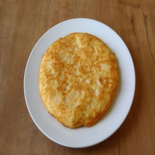 Torilla De Patata Con Bacalao Y Cebolla Confitada
