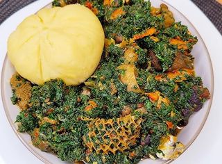 Vegetable soup + Garri + Goat meat