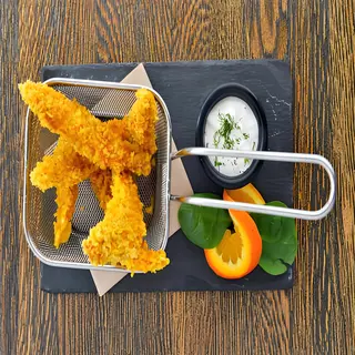 Панирани пилешки филенца с млечен сос  (250г)