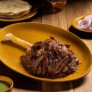 Raan Akbari 500 gm (Lamb Shank) Chef's Delicacy Served with Small Chips or Small Butter Naan