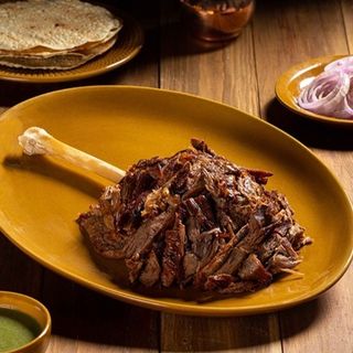 Raan Akbari 500 gm (Lamb Shank) with Naan or Chips