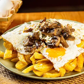 Con salteado de setas y queso de cabra a la plancha