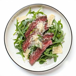 Tagliata di manzo con rucola e grana con contorno