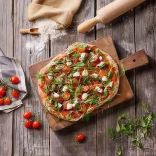 Pinsa de rúcula y tomate cherry