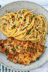 Boneless pan fried Chicken breast Spaghetti served with a soda or water 