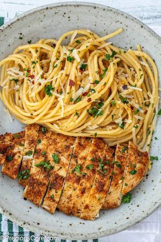 Boneless pan fried Chicken breast Spaghetti served with a soda or water 