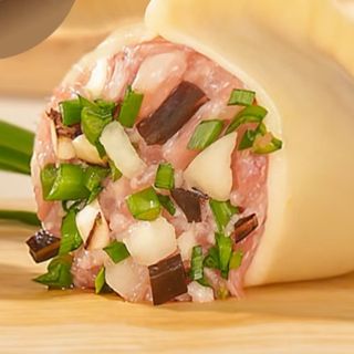 Ravioli con funghi champignon e carne di maiale