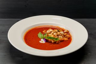 Tomatoes cream soup with basil