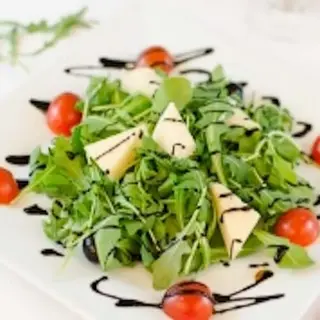 Rúcula con parmesano
