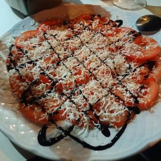 Tomate Aliñado Con queso de cabra