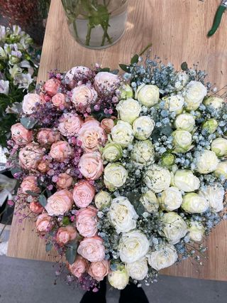 Pink and baby blue spray roses with gypsophila