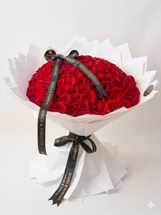 Red roses with scarlet white wrapping