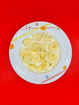 Agnolotti in crema tartufata bianca