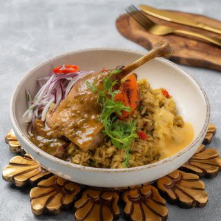 Pato Confitado Con Arroz Meloso