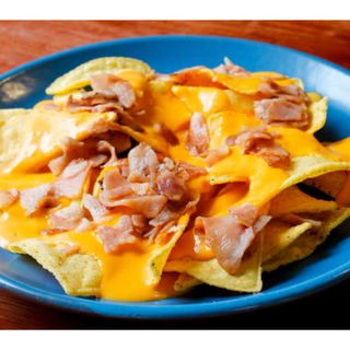 Tapa De Nachos Con Bacon Y Salsa Cheddar