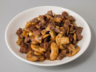 ternera con champiñones