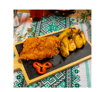 Snitel din muschiulet de porc în crustă panko cu parmezan si garnitura la alegere