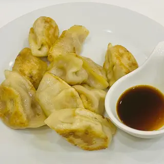 121. Ravioli di pollo con mais e curry 10 pezzi
