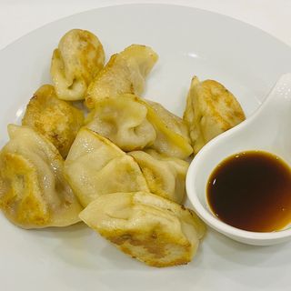 121. Ravioli di pollo con mais e curry 10 pezzi