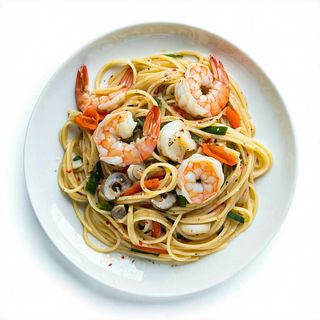 32 Spaghetti saltati con frutti di mare